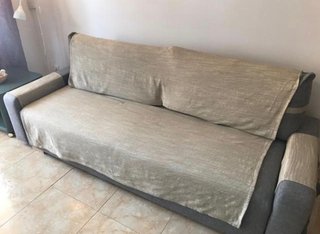 Sofá cama gris de tela