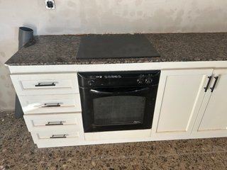 Cocina completa de madera y piedra