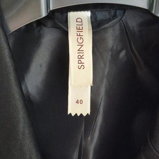 blazer negra satinada springfield elegante mujer 4