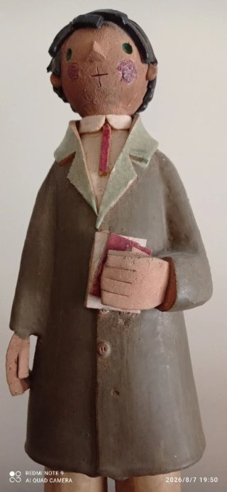 Figura cerámica vidriada hombre con libros