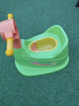 Moto orinal infantil verde y naranja
