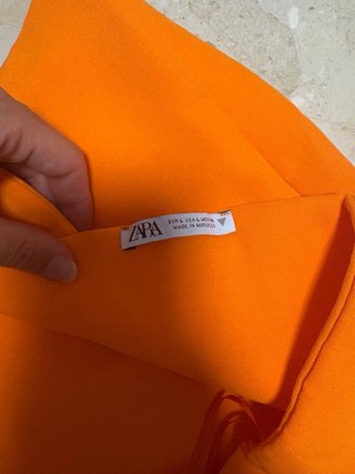 Top naranja fosforito asimétrico