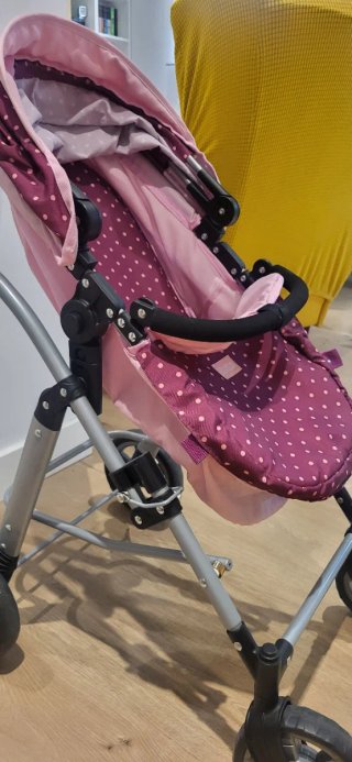 Carrito de juguete rosa con capota