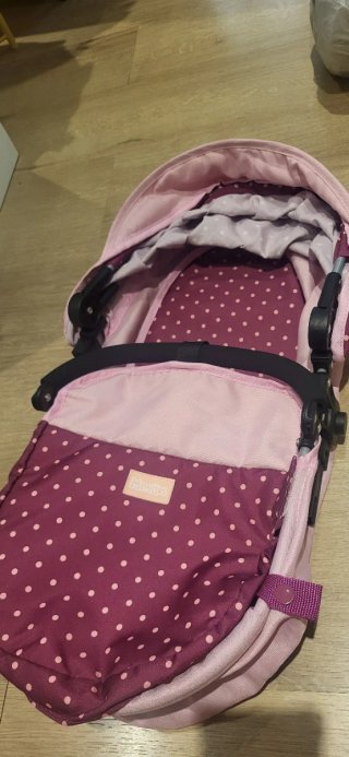 Carrito de juguete rosa con capota