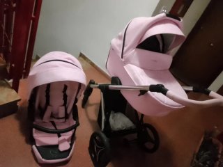 Carro de bebé rosa y negro poco uso iculle bolso