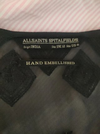 Blusa elegante con abalorios hechos a mano