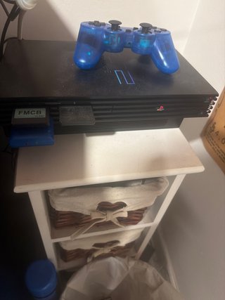 Console PS2 nera con controller blu wireless