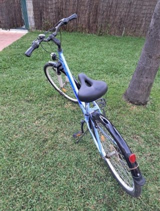 Bicicleta azul como nueva dhs travel