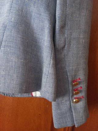Blazer REVER gris con detalles dorados