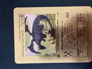 Carta Pokémon Charizard Dorado