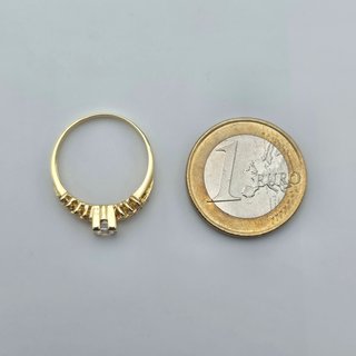 Solitario de oro de 18k con piedras. 2.48 gr. T-15