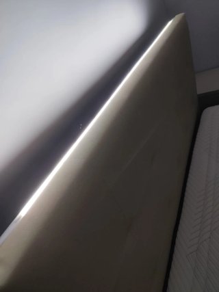 Cama 135/190 cm tapizada y base de madera