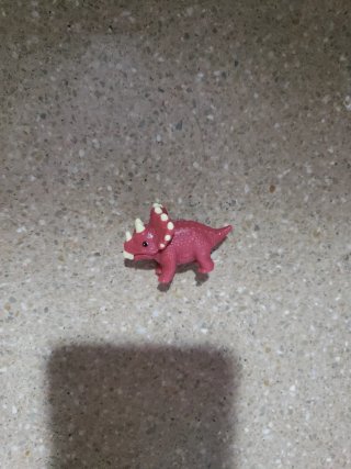 Dinosaurio rosa de juguete