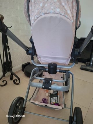 Cochecito de muñecas rosa