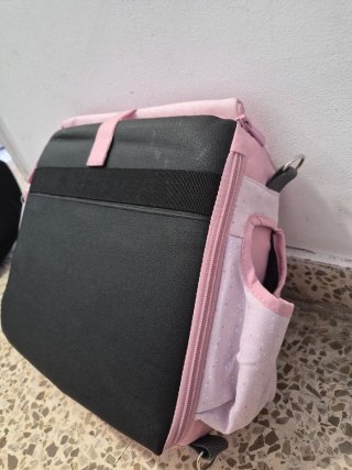 Trona de viaje rosa con estampado de topitos