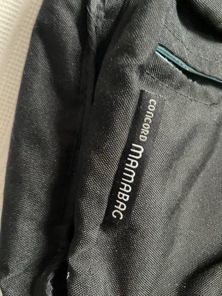 Bolsa pañalera Mamabag CONCORD negra y turquesa