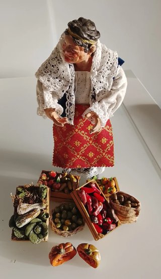 Venditrice di frutta , e verdura.