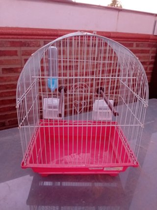 Jaula para pájaros blanca y roja