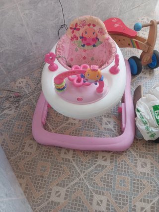 Tacatá bebé rosa con juguetes
