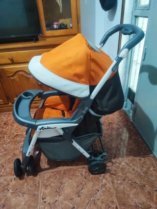 Silla de paseo bebé naranja y negra