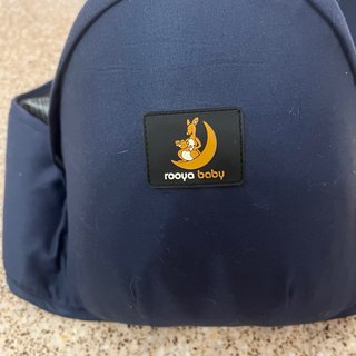 Portabebés de cadera azul con corazón amarillo
