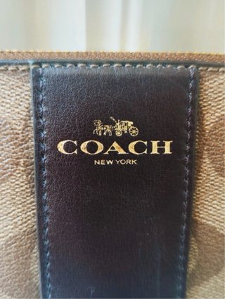 Coach Cartera de mano beige, negro y marrón.