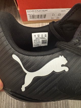 Botas de fútbol Puma negras y verdes
