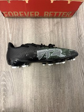 Botas de fútbol Puma negras y verdes