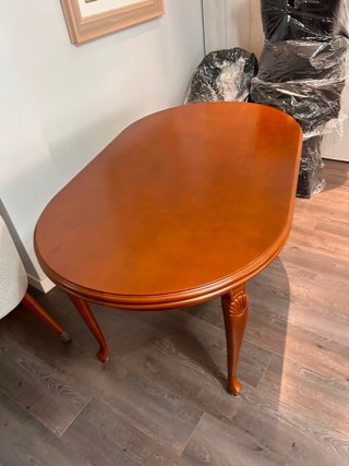 Mesa de comedor extensible ovalada de madera