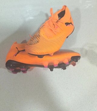 Botas de fútbol Puma Naranja y Rosa