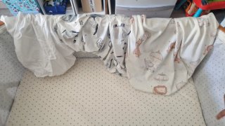 Cuna de viaje con estampado infantil
