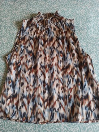 Camisa gasa transparente sin mangas