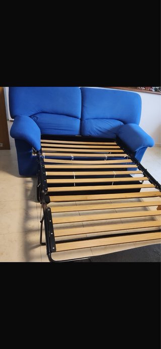 Sofá cama azul y sillón