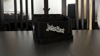 Supporto per plettri con accessori per chitarristi