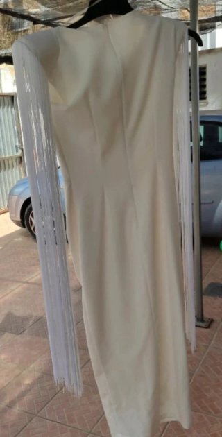 Traje de fiesta blanco con flecos