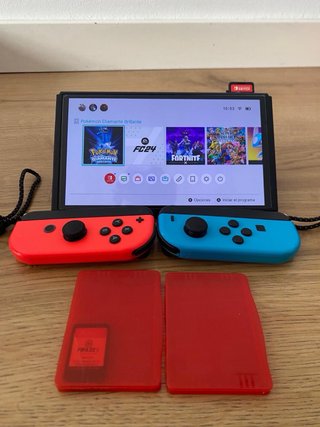Nintendo Switch OLED azul i roja + Accesorios