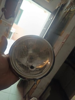 Faro de moto cromado