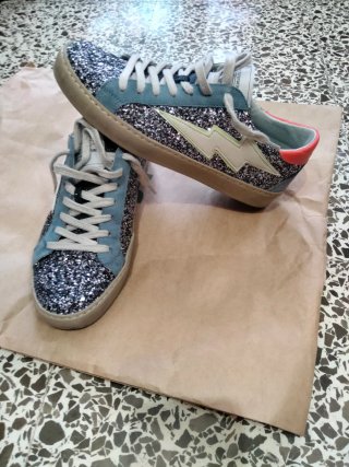 Zapatillas brillantes con rayo