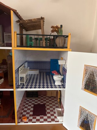 Casita de madera para muñecas