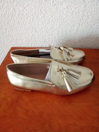 Mocasines dorados mujer con flecos