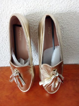 Mocasines dorados mujer con flecos