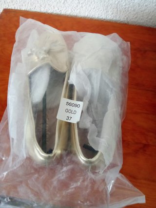 Mocasines dorados mujer con flecos