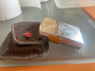 Mechero antiguo con funda