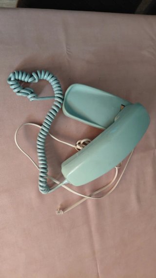 Teléfono antiguo azul