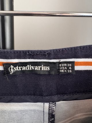 Pantalón corto de rayas marino y naranja