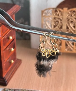Bolso pelo casa muñecas dorado