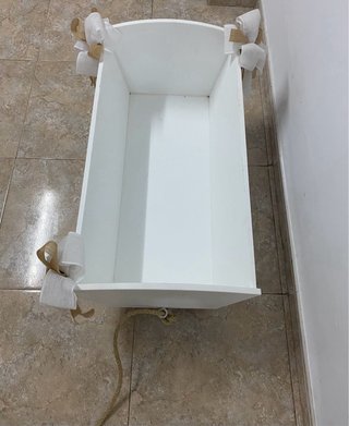 Carrito para llevar al niño al altar