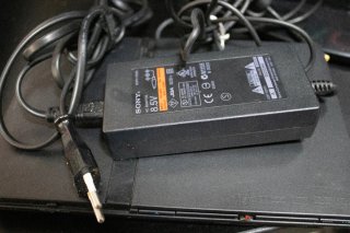 PlayStation 2 Slim Negra con cables y mando