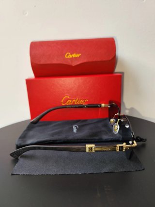 Gafas de sol Cartier negras y doradas