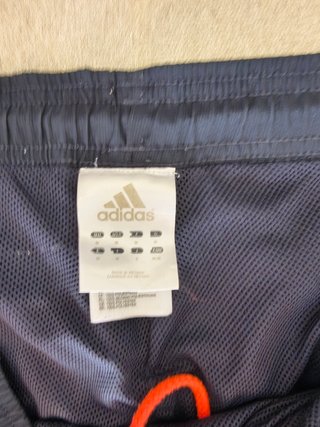 Pantalón de chándal Adidas azul y naranja